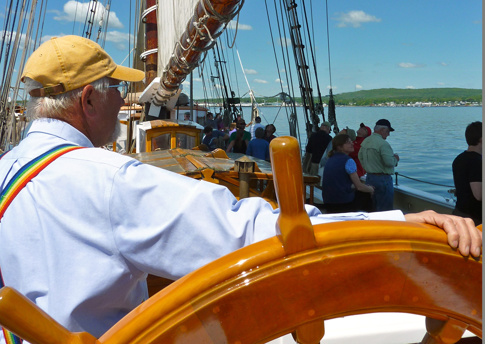 Captain Doug at the helm of the schooner Heritage, Rockland, Maine