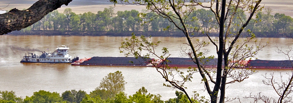 view of a coal-filled barge on the Ohio River from Blue Heron Winery, Cannelton, Indiana
