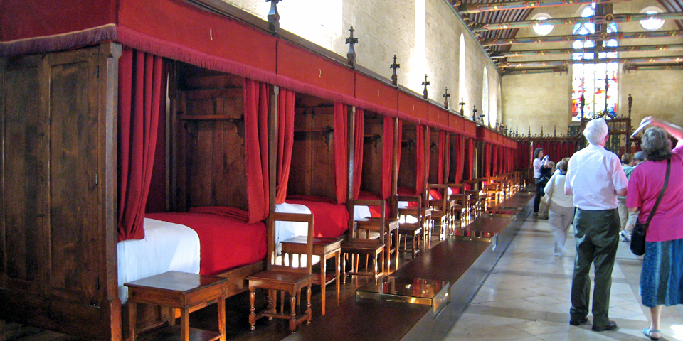Hôtel Dieu, Beaune, a hospice built to treat the famine and disease brought by the Hundred Year’s War. Beds were once shared without regard to gender.