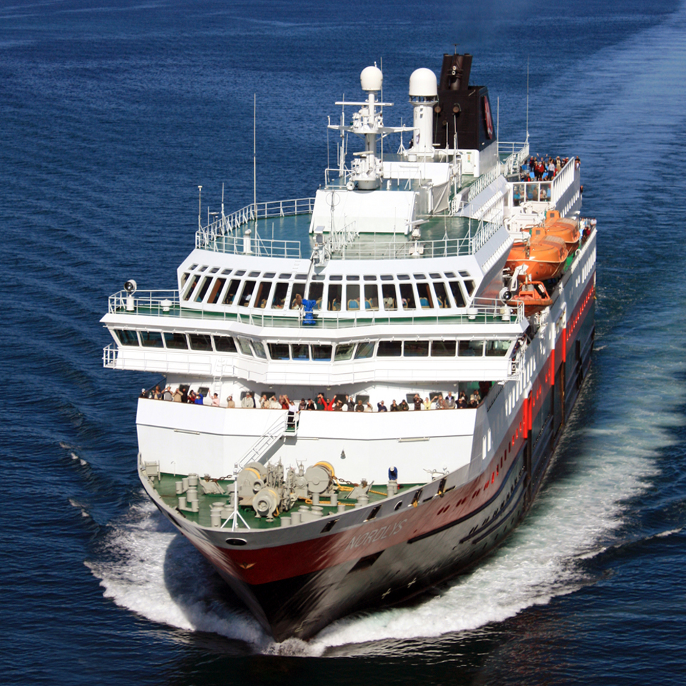 Hurtigruten’s Nordlys is shown here approaching the Blue City, Sortland, named for the color of its downtown buildings, 