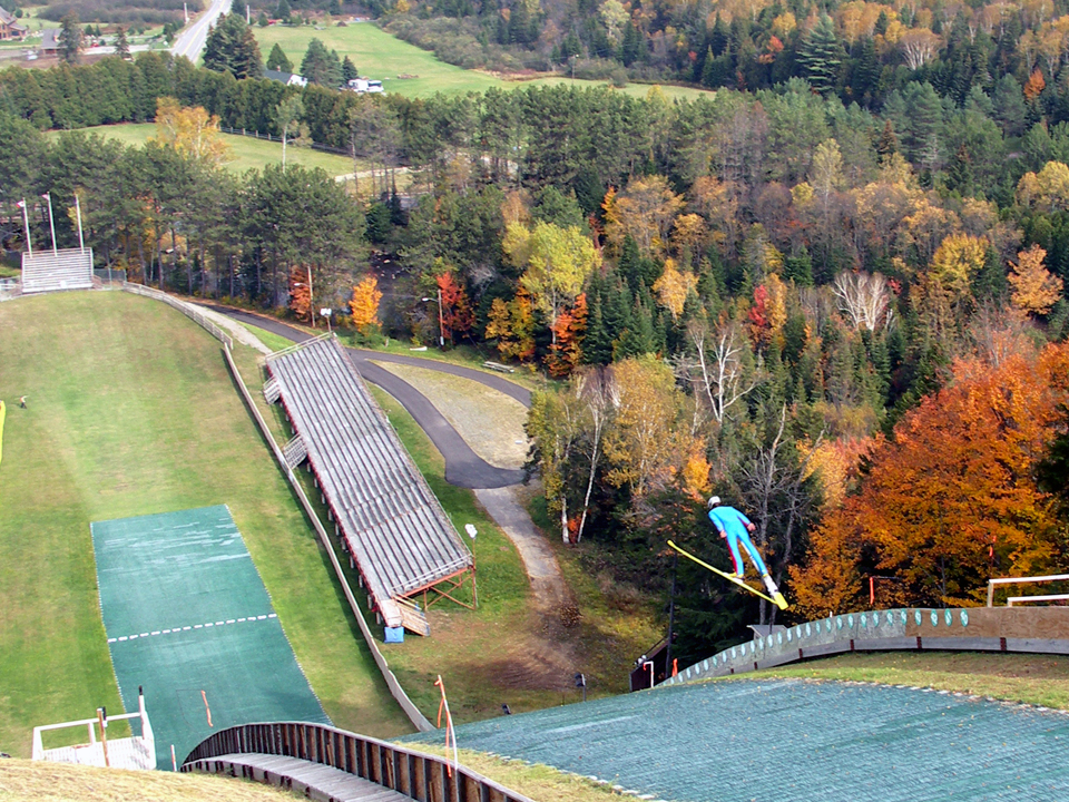 Watch athletes as they soar through the air at the Olympic Ski Jumping Complex.