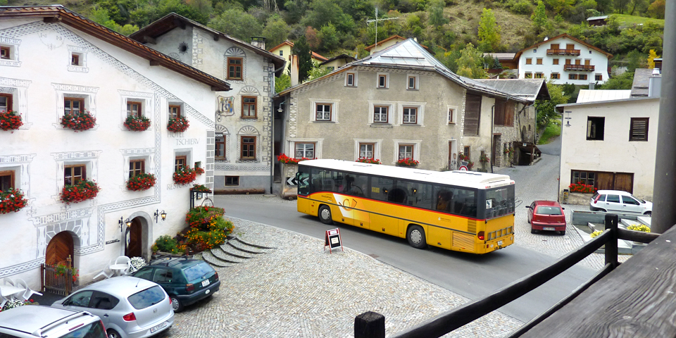 post bus in the historic square, Val Müstair, Switzerland