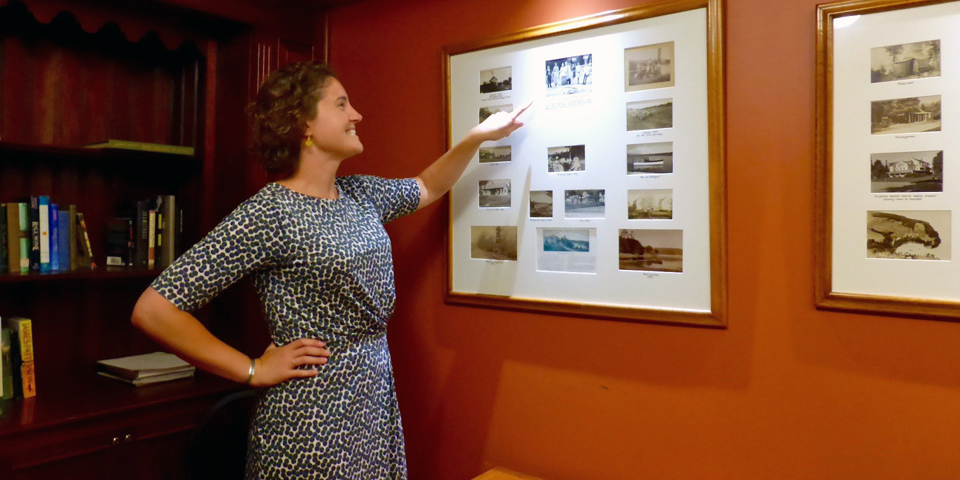 Fifth generation host Sarah Morris with favorite generational photos at the Basin Harbor Club, Vergennes, Vermont