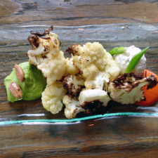Roasted Cauliflower, truffled pea pesto, salted almonds, feta dip and red bell essence, Etch 