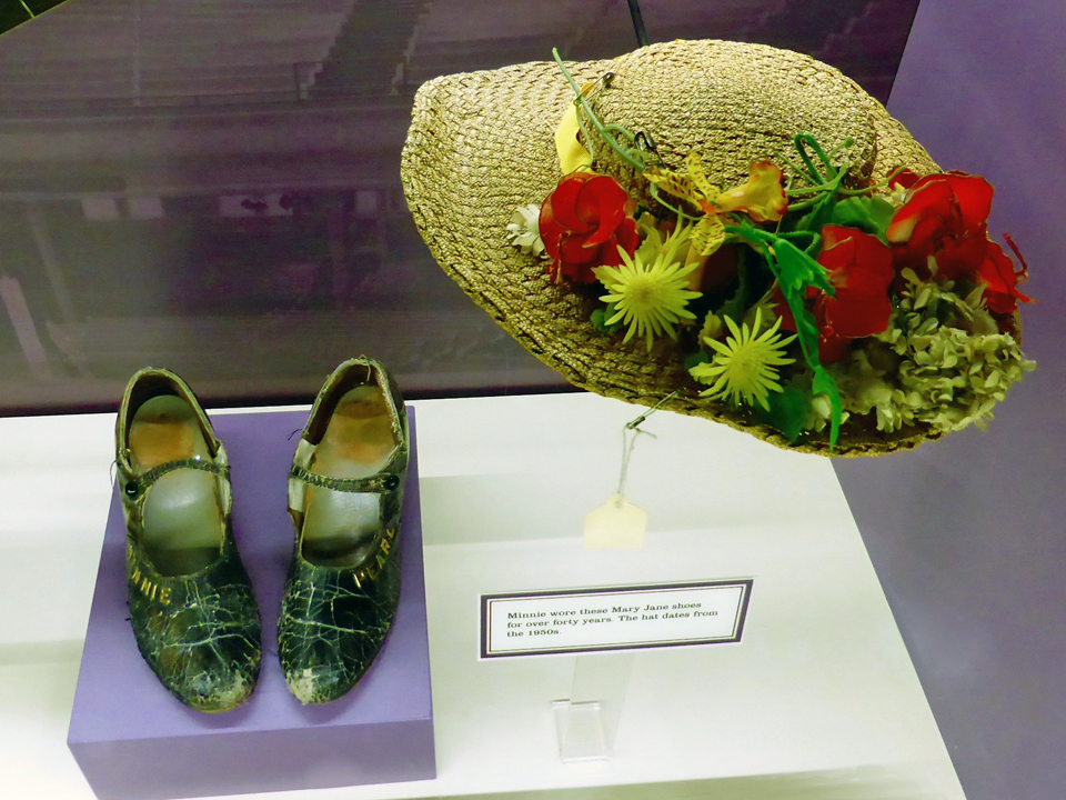Minnie Pearl, whose shoes and hat are displayed in this exhibit at the Ryman Auditorium, appeared in the Grand Ole Opry for over fifty years.