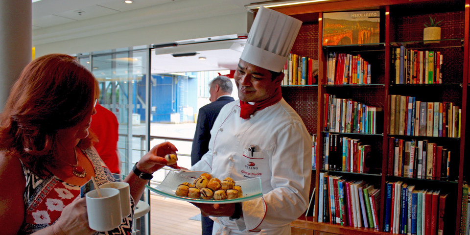 Viking Magni's Chef George Pereira with a sweet treat as passengers return from an excursion