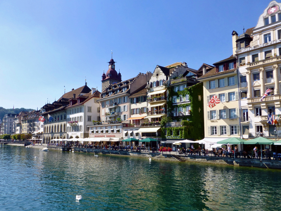 A row of restaurants in 17th century houses line the Reuss River in Lucerne.