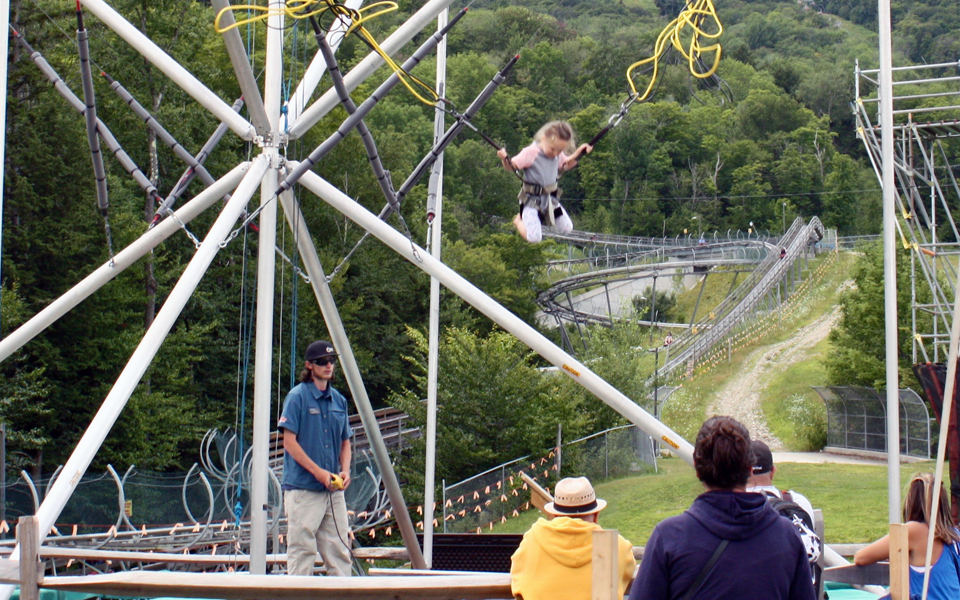 Bungee jump on a trampoline at the Adventure Zone of Okemo Mountain Resort