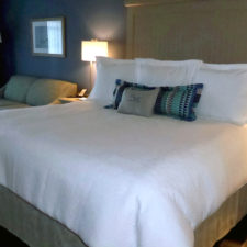 guest room bed, Chautauqua Harbor Hotel, Celoron, NY