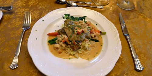 haddock Acadiane, pistachio crusted with lobster hollandaise, with saffron rice and seasonal vegetables at the MacKinnon-Cann Inn