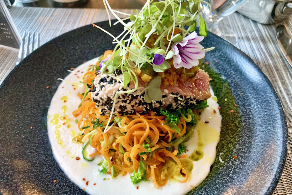 Seared tuna with sesame crust, spiralized vegetables and kale, lemon, coconut and cashew cream, galanga condiment and lime leaves, Spa Eastman
